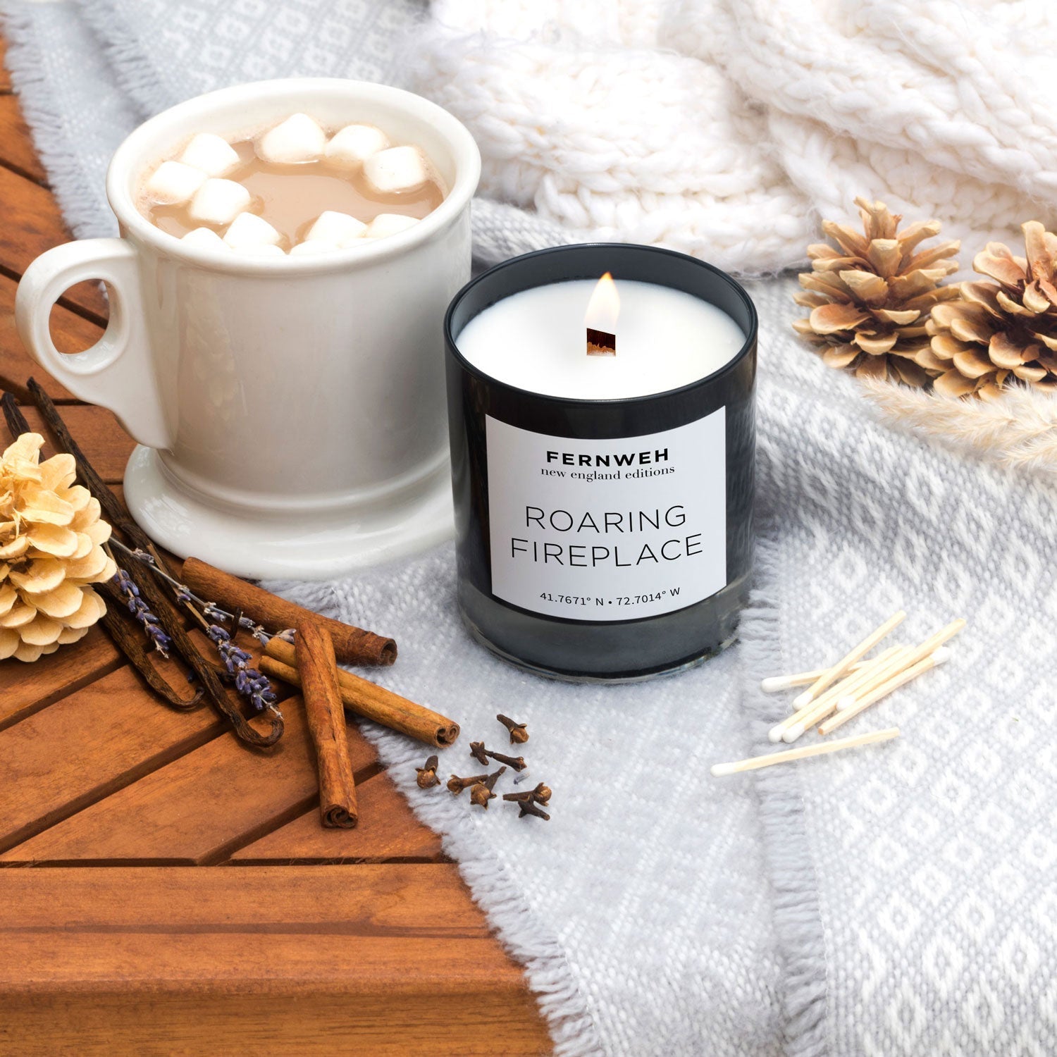 Lit Roaring Fireplace soy candle with hot cocoa, cinnamon and pinecones